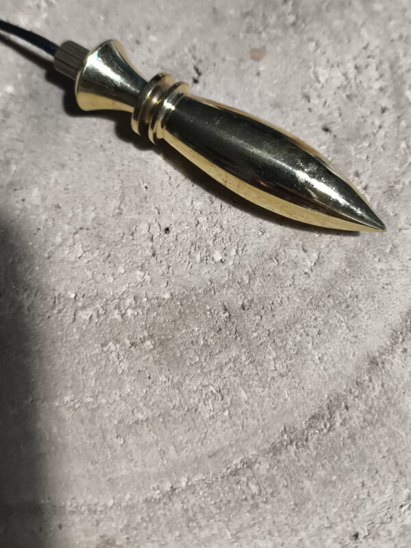 Péndulo metal dorado